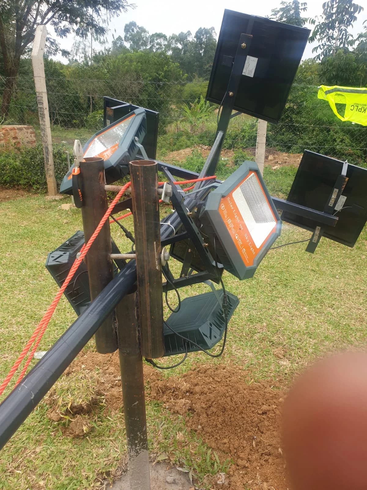 Solar-powered security floodlight and camera mast closeup