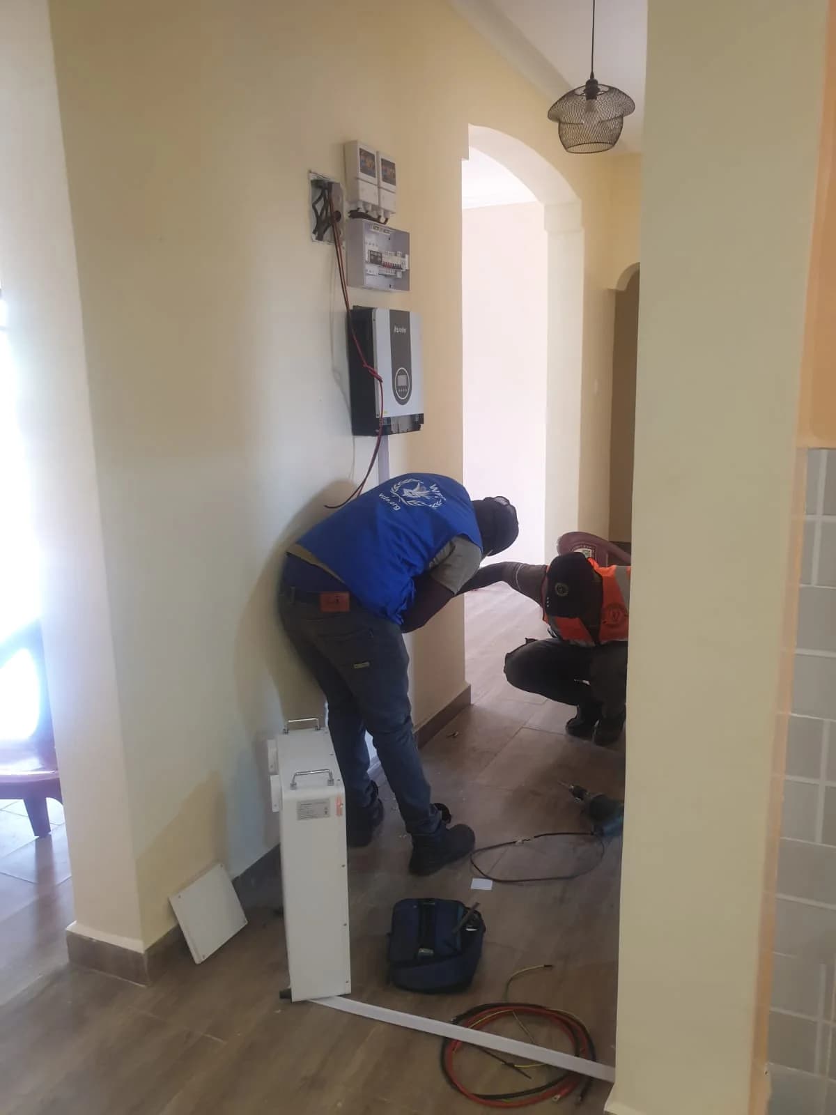 Two-man team commissioning a backup power system